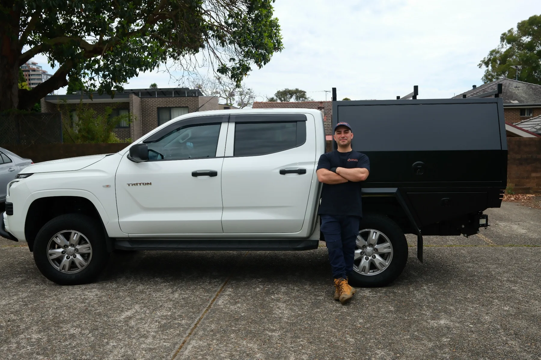 Goliath Pest Solutions technician standing beside branded service vehicle in Sydney