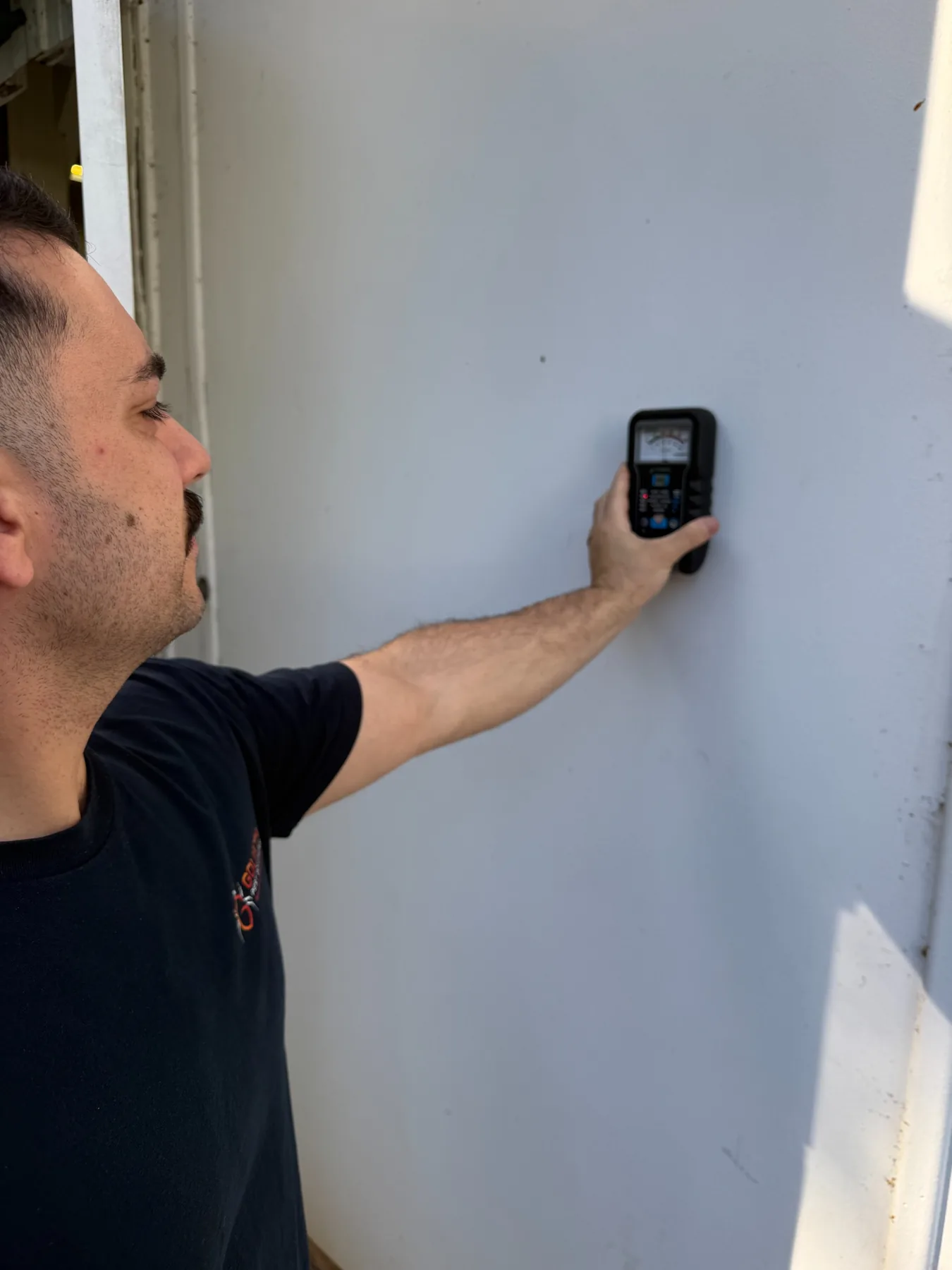 Goliath Pest Solutions technician carrying out a termite inspection using diagnostic equipment in Sydney